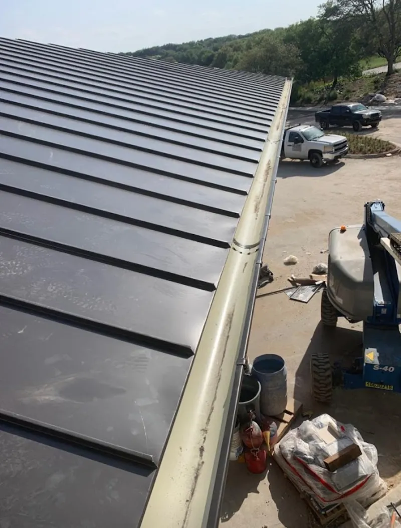 Standing seam panel and gutter detail on a metal roofing jobsite in Bethlehem